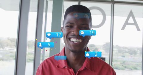 Cheerful influencer surrounded by social media icons