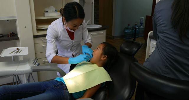 Dentist Treating Young Patient in Modern Clinic - Download Free Stock Images Pikwizard.com