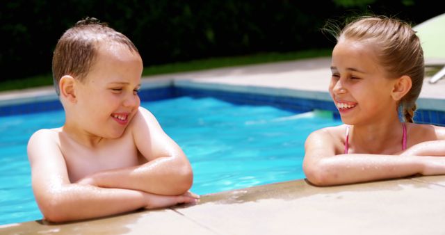 Happy sibling enjoying in swimming pool