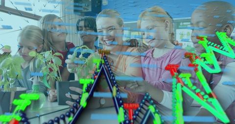 Teacher guiding students inspecting seedlings with augmented reality visualization