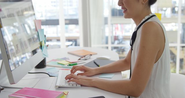 Woman Working on Computer in Bright Office Space - Download Free Stock Images Pikwizard.com