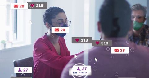Masked team collaborating in office with reaching gesture and social notification overlays