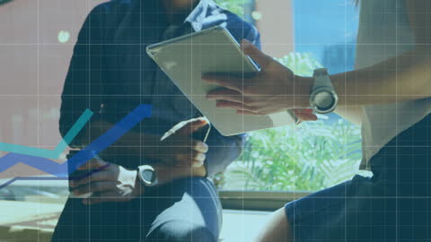 Business Professionals Analyzing Financial Data with Tablet