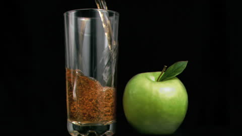 Super Slow Motion Apple Juice Splash with Green Apple