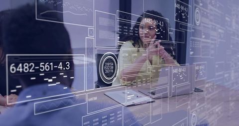 Businesswoman analyzing interactive data visualization and holographic analytics in meeting