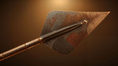 Rusted spearhead with triangular blade displaying historical textures