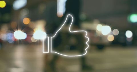 Neon Thumbs Up Icon on Blurred Urban Nightscape
