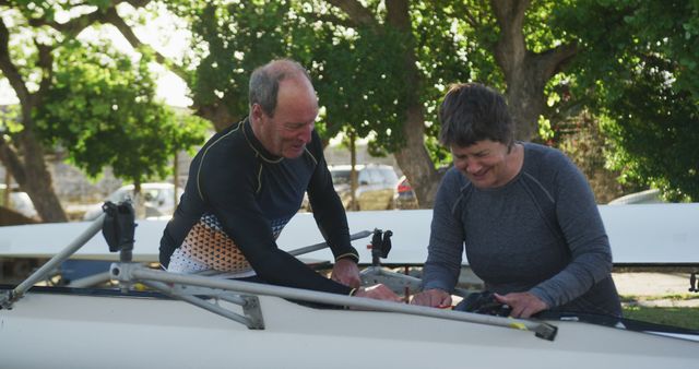 Senior Rowers Preparing Boat Outdoors on Sunny Day - Download Free Stock Images Pikwizard.com