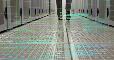 Businessman Walking Through Data Server Room with Digital Overlay