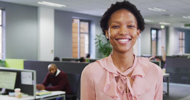 Confident Young Businesswoman Smiling in Modern Office Environment - Download Free Stock Images Pikwizard.com