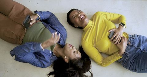 Diverse Female Friends Relaxing and Laughing Together