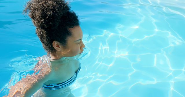 Woman Swimming in Clear Blue Pool Water - Download Free Stock Images Pikwizard.com