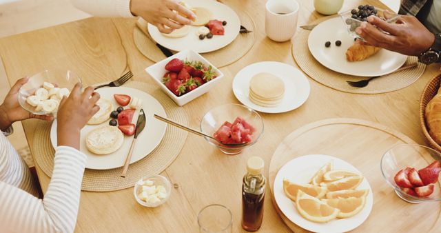 Family Enjoying Healthy Breakfast Together at Table - Download Free Stock Images Pikwizard.com