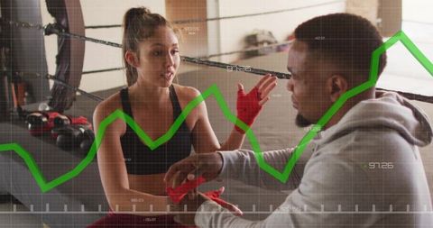 Boxer and Coach Focused on Training with Graph Overlay