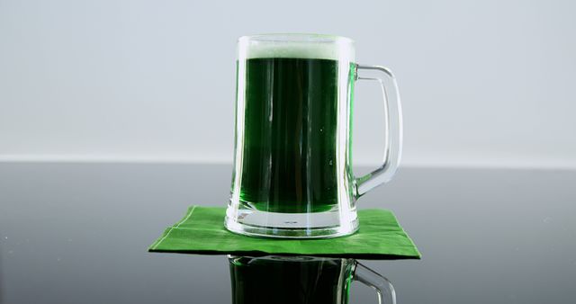 Glass of Green Beer on Reflective Surface - Download Free Stock Images Pikwizard.com