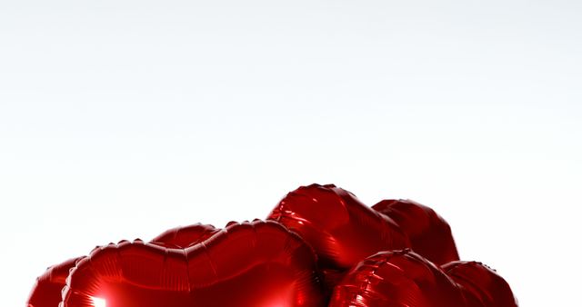Bright red heart-shaped balloons create sense of romance and celebration. Perfect for use in Valentine’s Day promotions, wedding invites, or any love-themed event advertising. Also ideal for social media graphics, party decorations, or online greeting cards.