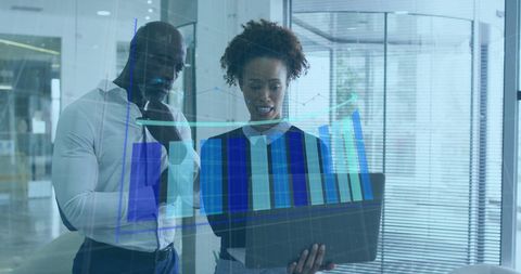 Diverse Professionals Analyzing Financial Data Hologram in Modern Office