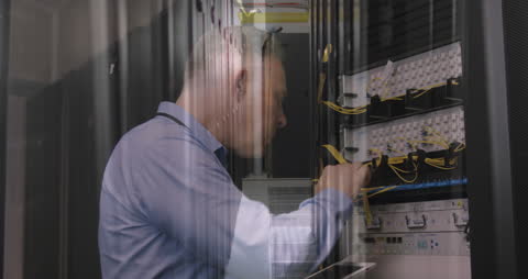 Technician Performing Maintenance on Data Center Server