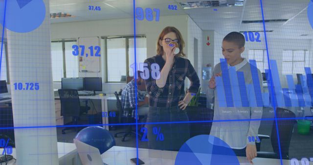 Businesswomen Analyzing Data Projections in Modern Office - Download Free Stock Images Pikwizard.com