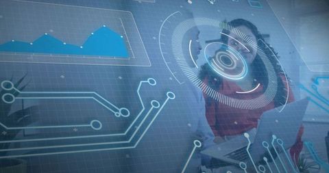 Woman collaborating with holographic HUD showing real-time data visualization over laptop