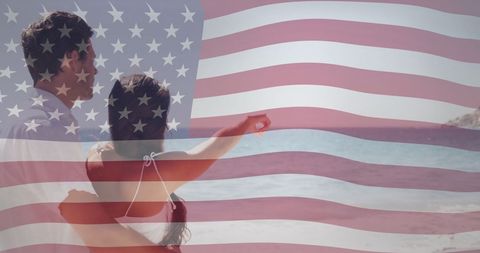 Romantic couple embracing with american flag overlay