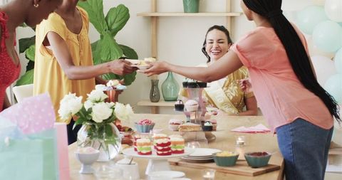 Diverse Women Celebrating Bridal Shower with Decor and Desserts