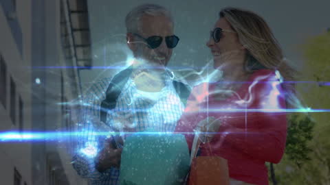 Senior Couple Enjoying Digital Tablet with Light Trails Effect