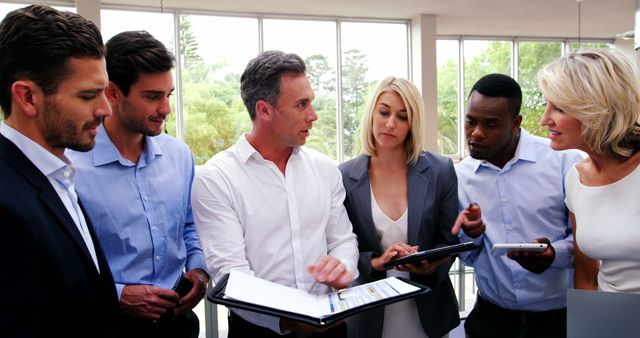 Diverse business team discussing strategies during meeting - Download Free Stock Images Pikwizard.com