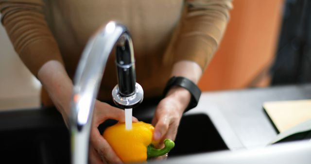 Person Washing Yellow Bell Pepper Under Kitchen Faucet - Download Free Stock Images Pikwizard.com