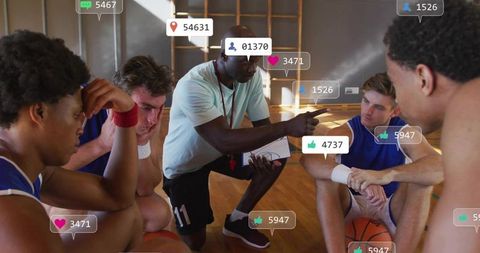 Kneeling coach directing basketball team during timeout with social media engagement overlays