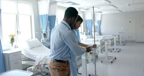 Doctor Assisting Patient in Modern Hospital Ward - Download Free Stock Images Pikwizard.com