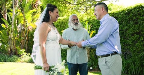 joyful garden wedding ceremony with diverse officiant - Download Free Stock Images Pikwizard.com