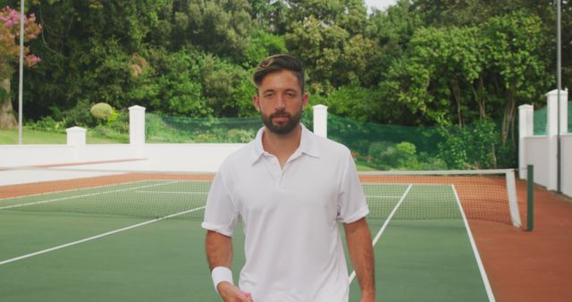 Confident Young Male Tennis Player on Outdoor Court - Download Free Stock Images Pikwizard.com