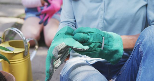 People Wearing Gardening Gloves While Working in Garden - Download Free Stock Images Pikwizard.com