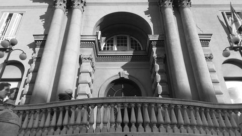 Historic Architectural Facade with Arched Windows and Columns in Black and White
