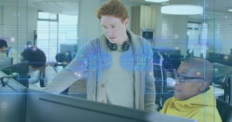 Software engineers collaborating in modern office environment