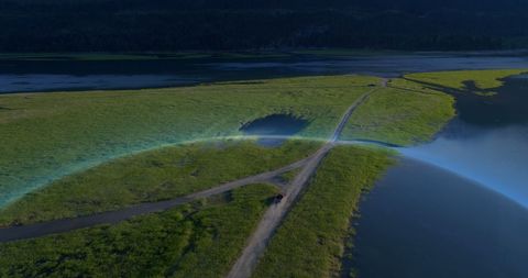 Globe Overlay on River Landscape Imagery for Technological Themes