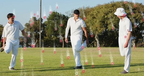 Three cricketers warming up on sunlit field with digital binary overlay for sports analytics
