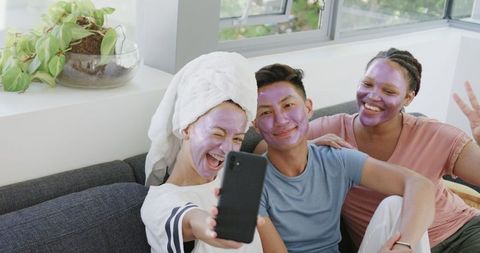 Friends Enjoying Skincare and Selfie Fun on Relaxing At-Home Spa Day