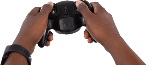 Close-up transparent hands holding black game controller