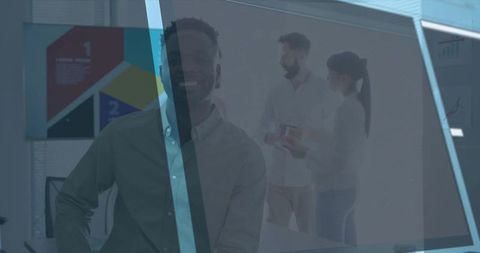 Smiling black professional leaning by blue glass partition in collaborative office meeting