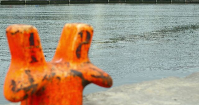 Blurred Orange Bollard over Serene River Water - Download Free Stock Images Pikwizard.com
