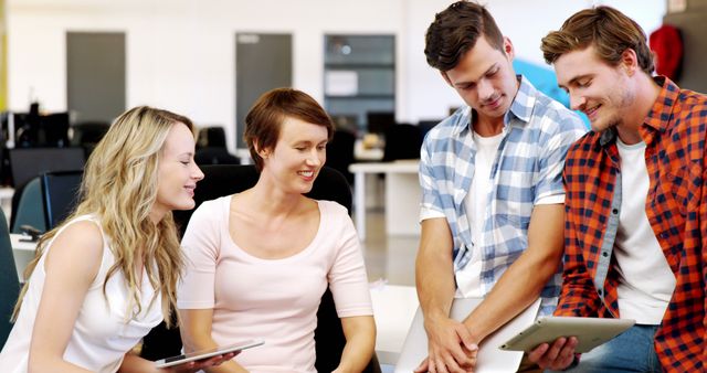 Young Professionals Collaborating at Office with Digital Tablets - Download Free Stock Images Pikwizard.com