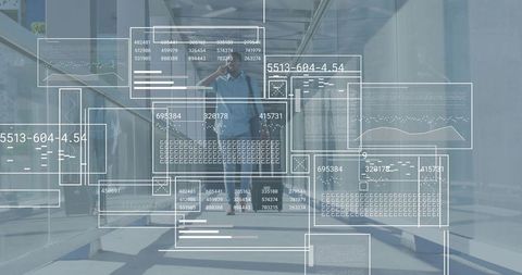 Commuter walking and talking on phone through glass office corridor with data overlay