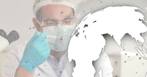 Asian scientist inspecting vaccine sample with syringe in global laboratory research concept