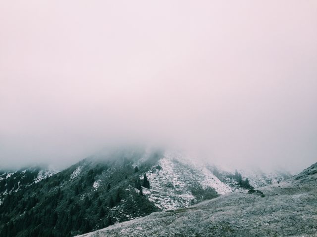 Snow-Covered Mountains Overlooks by Misty Clouds - Download Free Stock Photos Pikwizard.com
