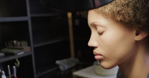 Jeweller focused on crafting in workshop environment