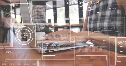 Woman Analyzing Data on Laptop in Urban Cafe Environment