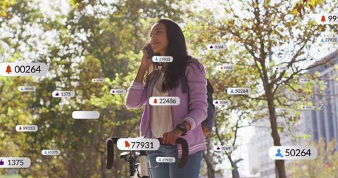 Hispanic woman on phone with notifications in urban park