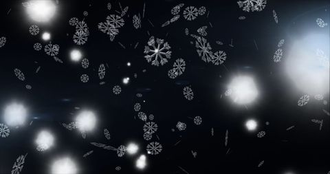 Dazzling Snowflakes Gracefully Falling Against Dark Backdrop
